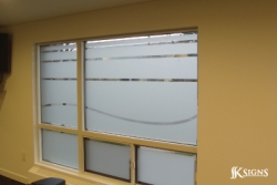 Custom cut etched glass film install in a fitness room