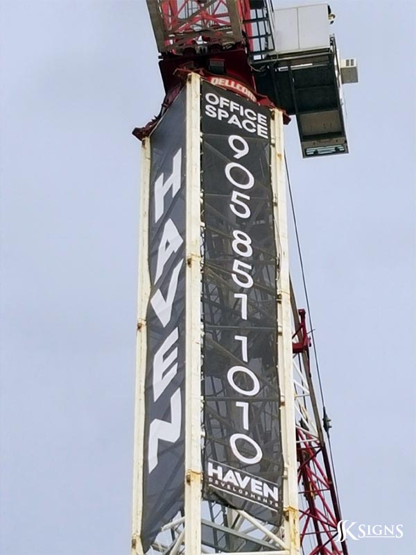 409-large-banner-installed-on-a-crane-in-toronto