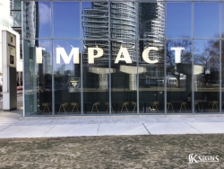 Window vinyl letters at Impact Kitchen in Toronto