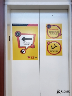 Social distancing decals installed on elevator